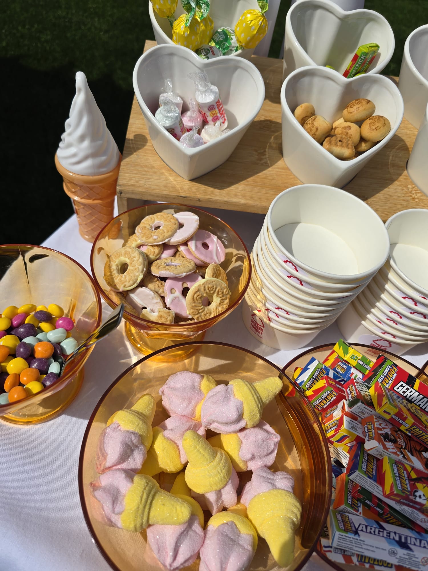 The Creation Station toppings table with marshmallows and sweets